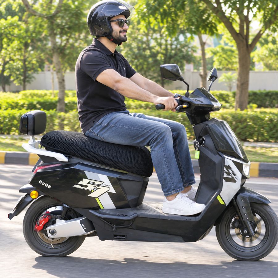 Rider on a scooty with the mesh seat cover